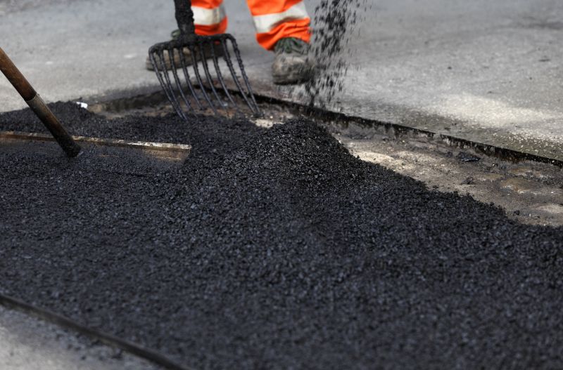 Local Blacktop Driveway Resurfacing pros at work